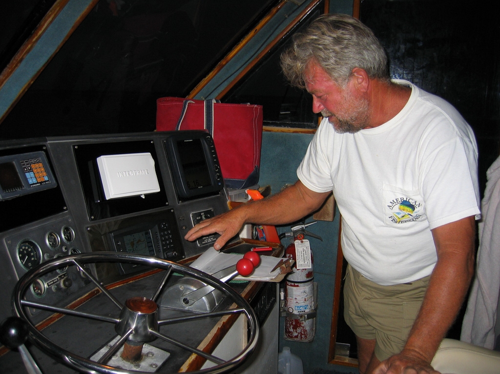 Capt. Jo Jo in the Pilot House of the M/V Playmate